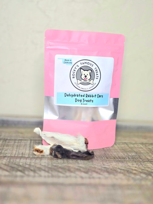 dehydrated raw rabbit ears for dogs, in a pink bag with Rocky's Famous Treats logo